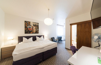 PrivatHotel Probst - premium_tv_sitzecke_boxspringbett_schlafen_doppelz